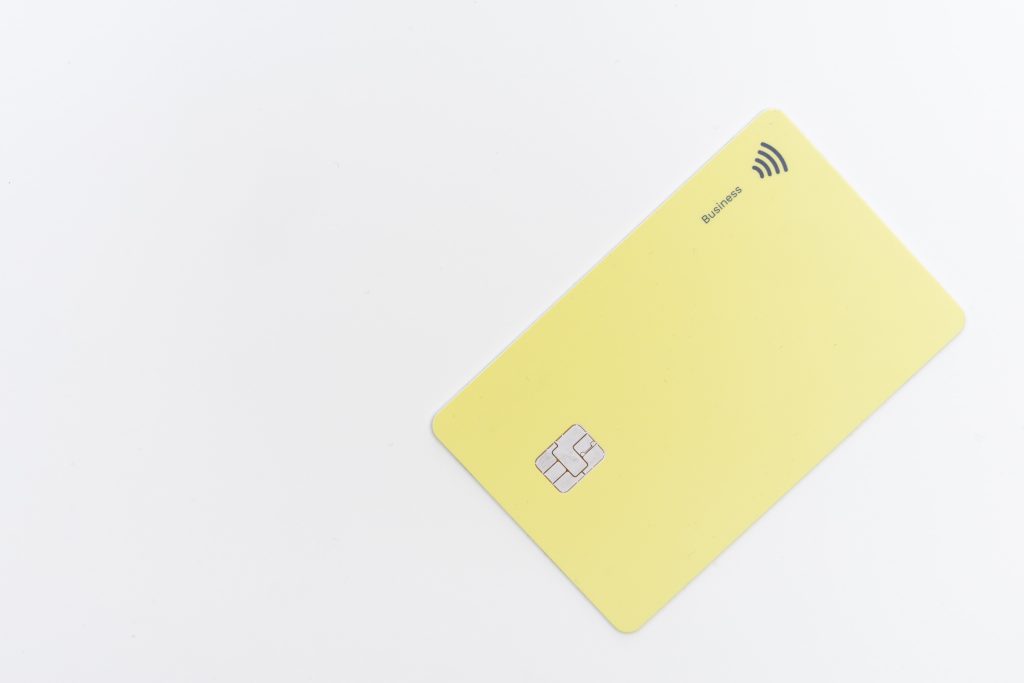Yellow card on a white surface.