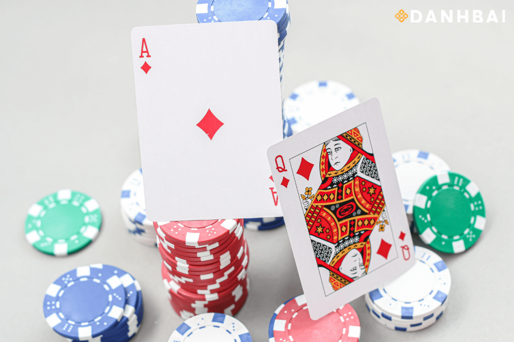 Ace and King cards, with a blurred background featuring a blackjack table.